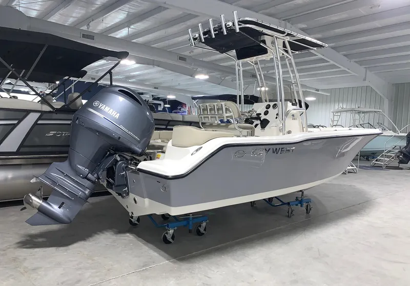 Slide: The Image of 2024 Key West 203 FS boat with Yamaha outboard motor in showroom. - 0