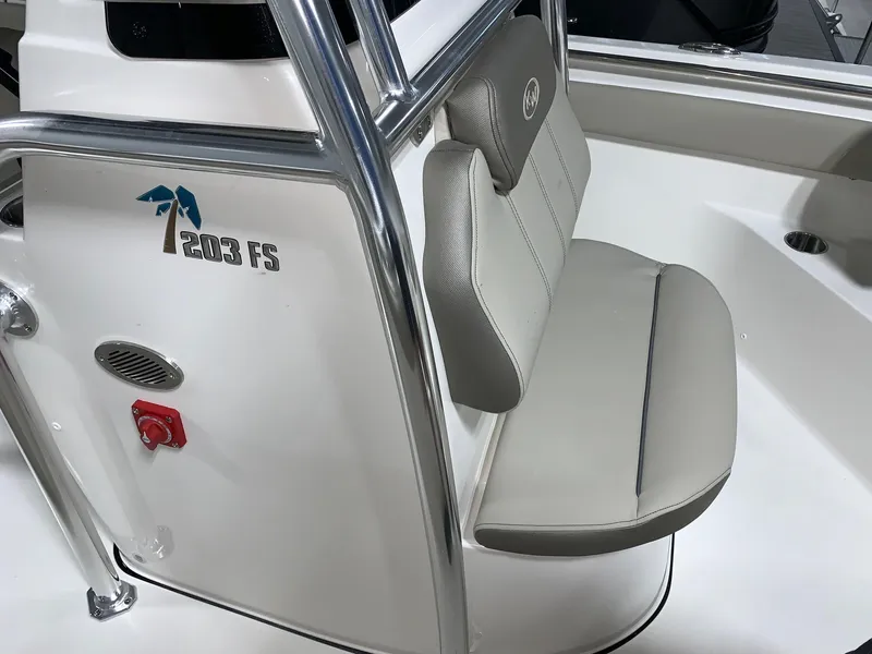 Slide: The Image of 2024 Key West 203 FS boat interior with seating and logo. - 11
