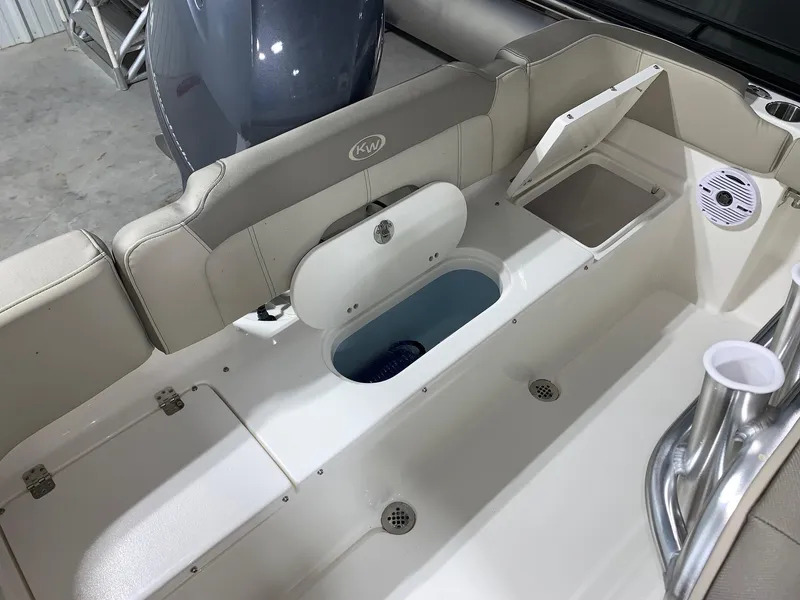 Slide: The Image of 2024 Key West 203 FS boat interior with storage compartments and seating. - 5