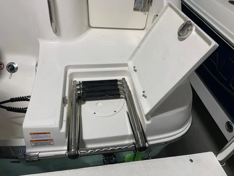 Slide: The Image of 2024 Robalo R222 Explorer swim platform with foldable ladder. - 14