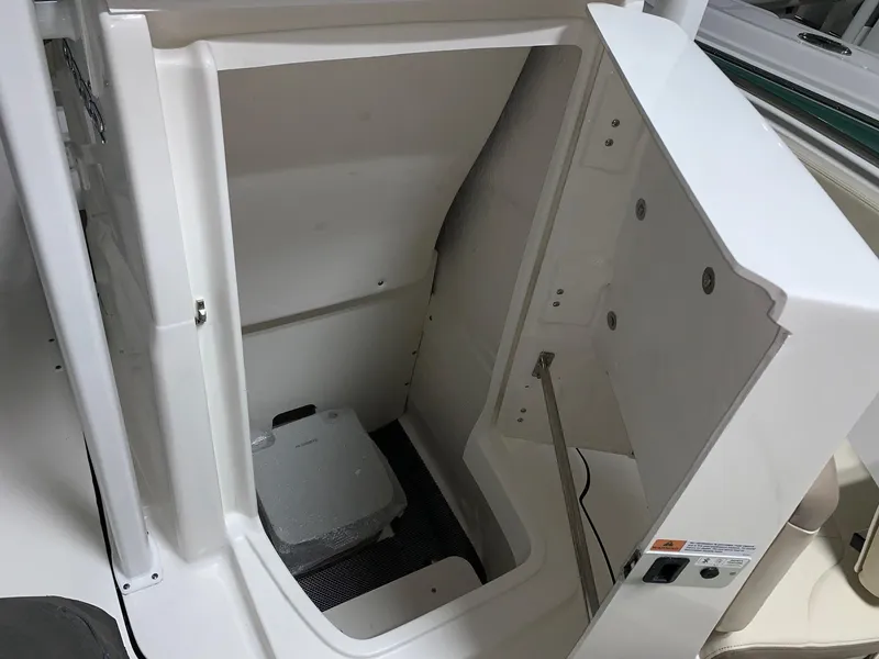 Slide: The Image of 2024 Robalo R222 Explorer boat interior storage compartment. - 12