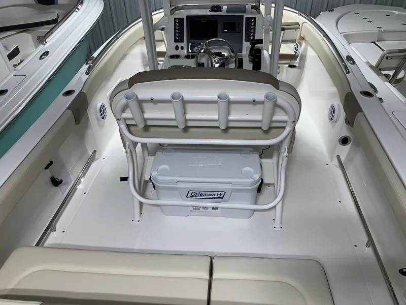 Slide: The Image of 2024 Robalo R222 Explorer boat interior with seating and console. - 3
