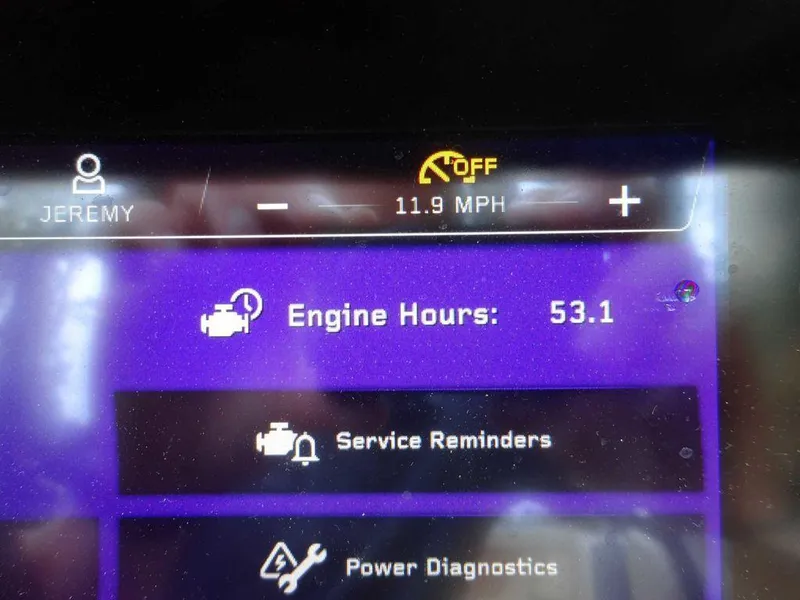 Slide: The Image of 2023 Nautique S21 dashboard showing 53.1 engine hours, 11.9 MPH speed, and service reminders. - 19