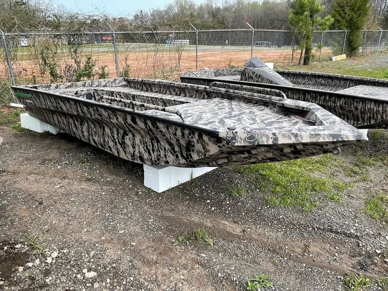 Slide: The Image of 2022 Havoc 1860 Dbst boat with camouflage design on display outdoors. - 4