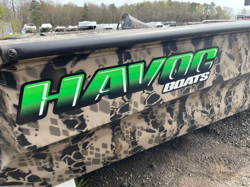 Slide: The Image of 2022 Havoc 1860 Dbst boat with camouflage design and green logo. - 5