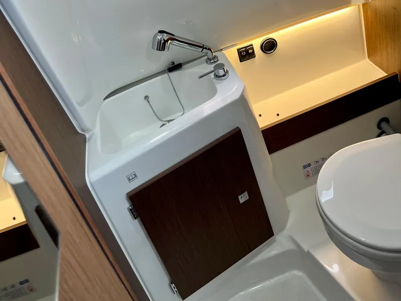Slide: The Image of 2024 Jeanneau Leader 9.0 CC bathroom with sink, faucet, and toilet. - 19