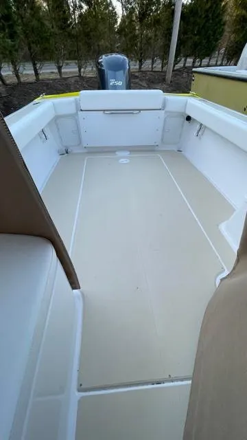 Slide: The Image of 2022 NorthCoast 235 HT boat interior with spacious deck and modern design. - 10