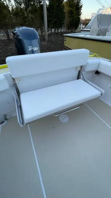Slide: The Image of 2022 NorthCoast 235 HT boat with foldable white bench seat and Yamaha 250 engine. - 11