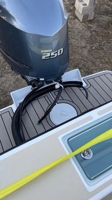 Slide: The Image of NorthCoast 235 HT 2022 boat with Yamaha 250 engine, docked on wooden platform. - 9