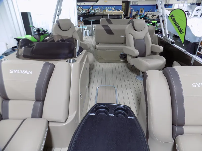 Slide: The Image of 2022 Sylvan L3 DLZ pontoon boat interior with beige seating and modern design. - 1