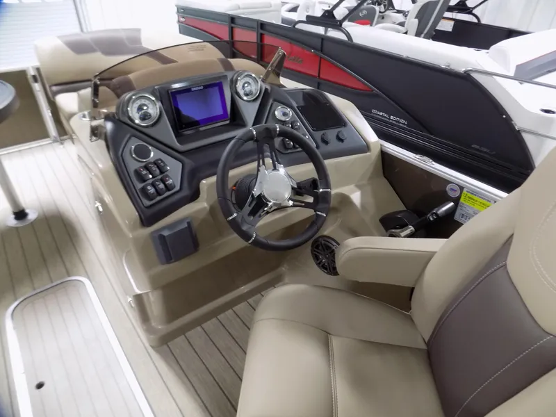 Slide: The Image of 2022 Sylvan L3 DLZ boat interior with steering wheel and control panel. - 3