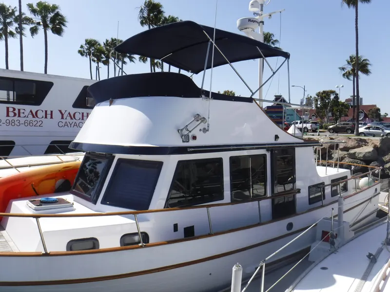 The Image of 1979 Sea Ranger 37 yacht docked with sun canopy. - 0