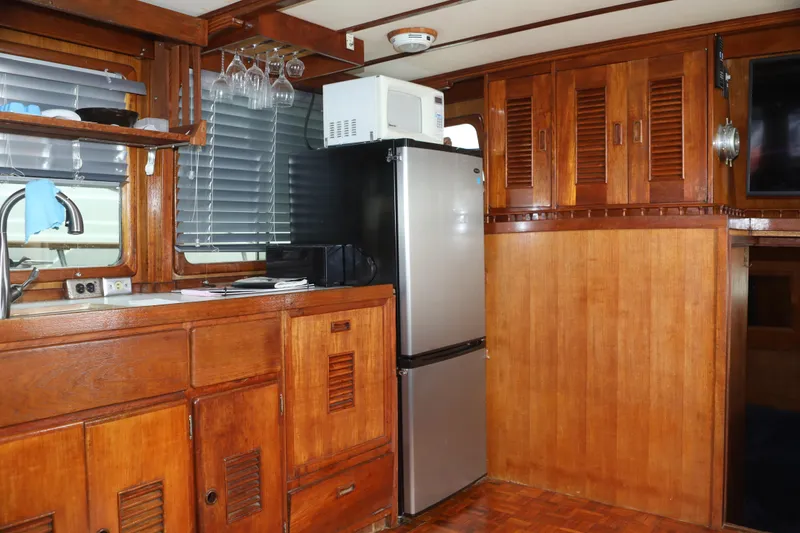 Slide: The Image of Interior of a 1979 Sea Ranger 37 yacht with wooden cabinetry. - 11