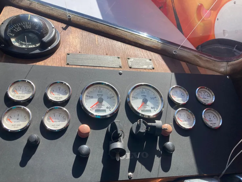 Slide: The Image of Dashboard of a 1979 Sea Ranger 37 boat with various gauges. - 32