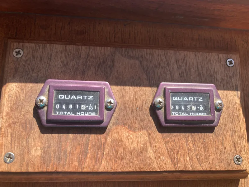 Slide: The Image of Two quartz hour meters on wooden panel, Sea Ranger 37, year 1979. - 33
