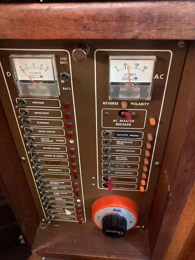 Slide: The Image of 1979 Sea Ranger 37 electrical panel with gauges and switches. - 35