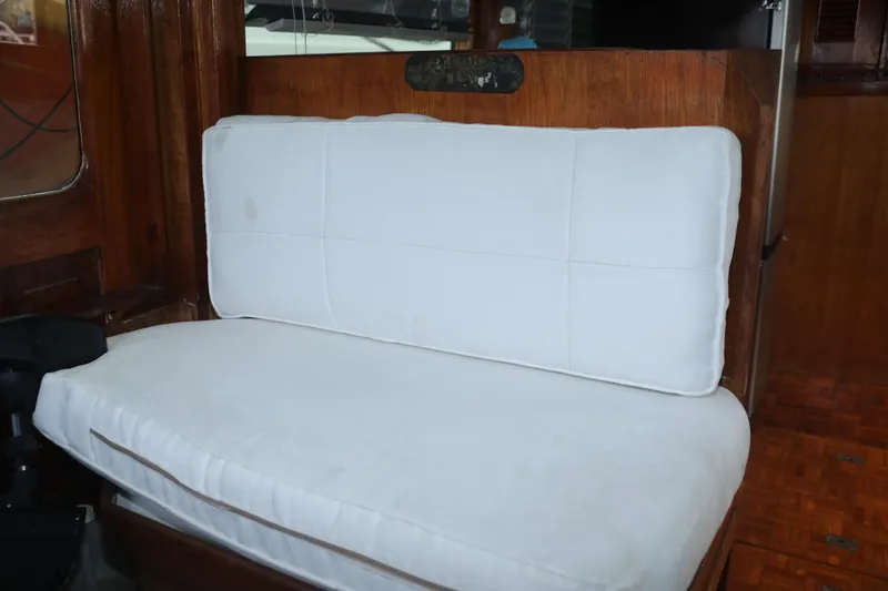 Slide: The Image of 1979 Sea Ranger 37 interior with white cushioned seating. - 4