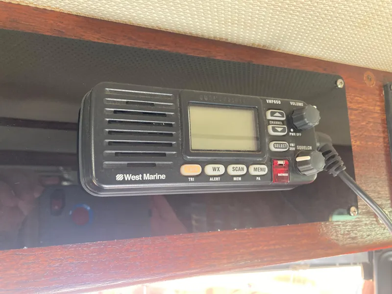 Slide: The Image of West Marine radio in a 1979 Sea Ranger 37. - 40