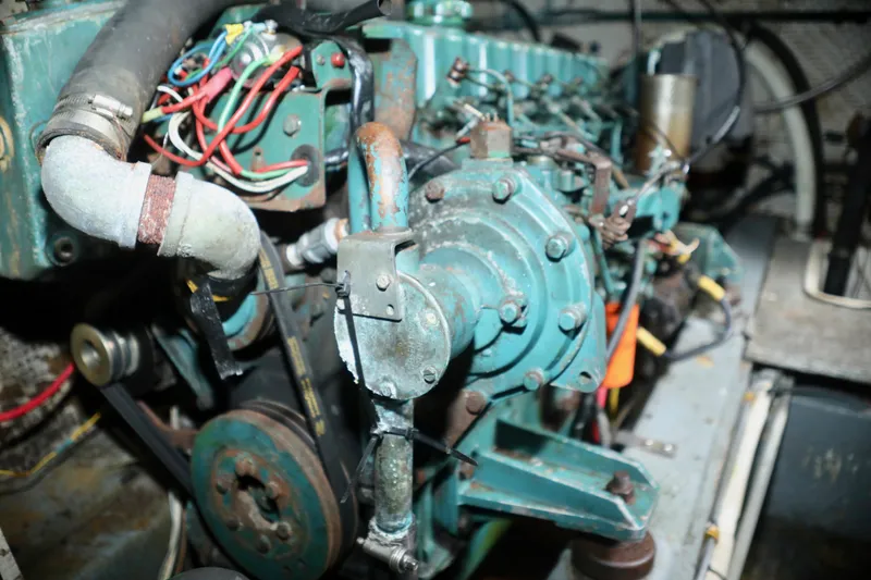 Slide: The Image of Engine room of a 1979 Sea Ranger 37 boat, showing engine and wiring. - 43
