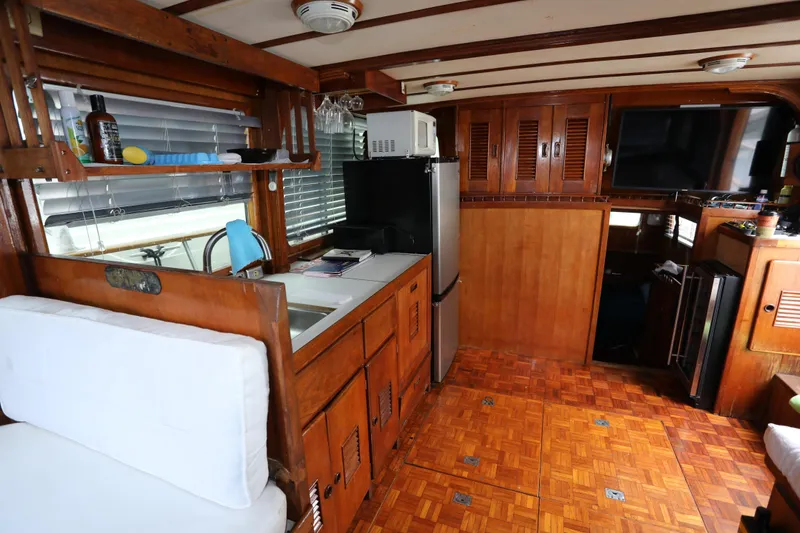 Slide: The Image of Interior of a 1979 Sea Ranger 37 yacht with wooden furnishings. - 7