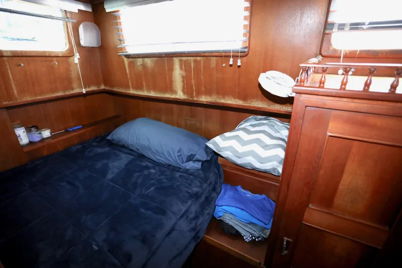 Slide: The Image of Interior of a 1979 Sea Ranger 37 yacht with cozy bedroom. - 8