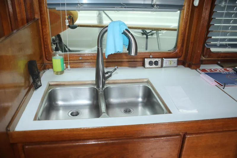 Slide: The Image of Kitchen area on a 1979 Sea Ranger 37 boat. - 9