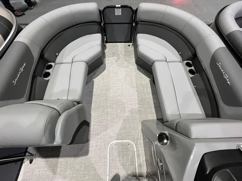 Slide: The Image of 2023 South Bay S224CR2 2.75 pontoon boat interior with gray seating and cup holders. - 4