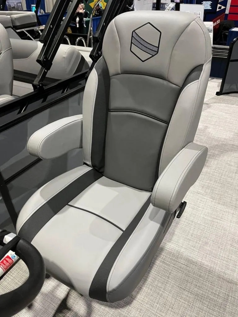 Slide: The Image of 2023 South Bay S224CR2 2.75 boat seat, gray and black, with armrests and logo. - 8