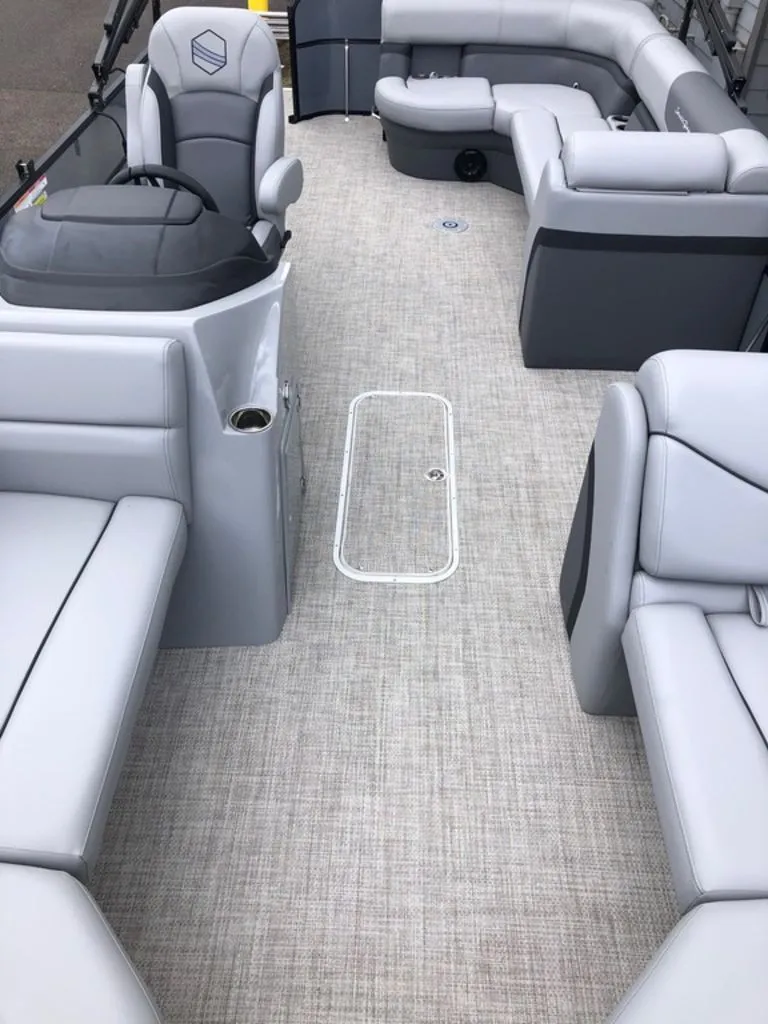 Slide: The Image of 2023 South Bay S224CR2 2.75 pontoon boat interior with gray seating and flooring. - 9