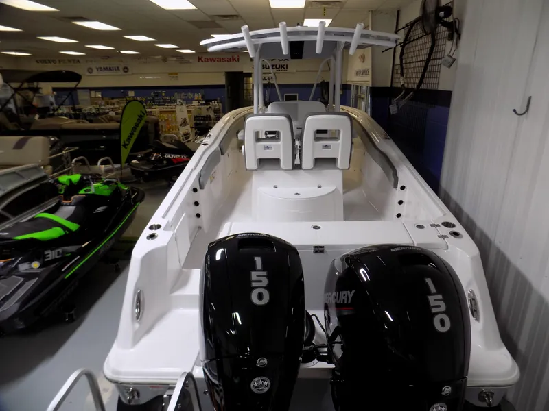 Slide: The Image of 2022 Aquasport 2500 boat with dual Mercury 150 engines in showroom. - 10