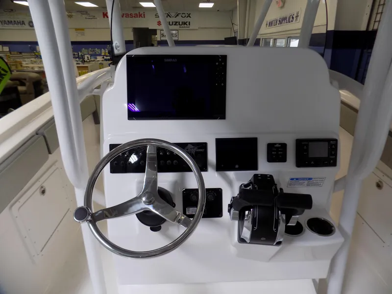 Slide: The Image of 2022 Aquasport 2500 boat dashboard with steering wheel and control panel. - 6