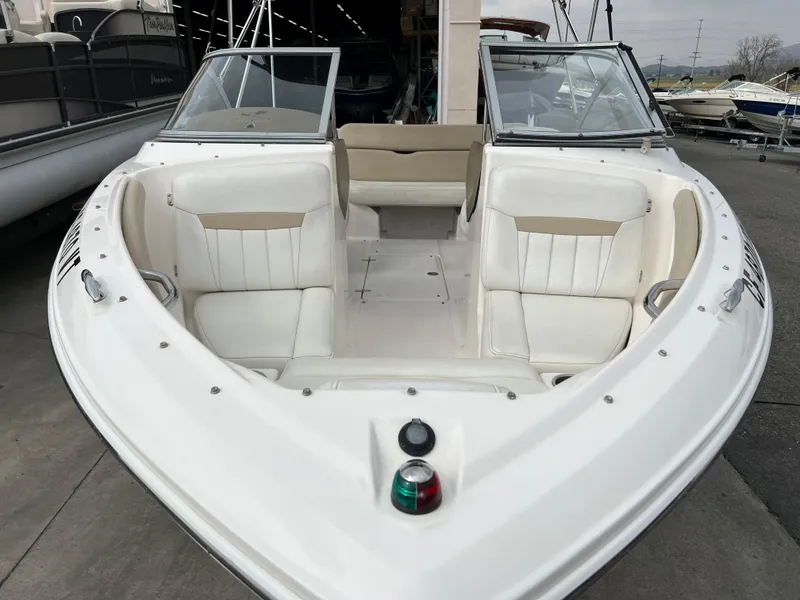 Slide: The Image of 2013 Regal 1900 boat with white interior and bow seating. - 4