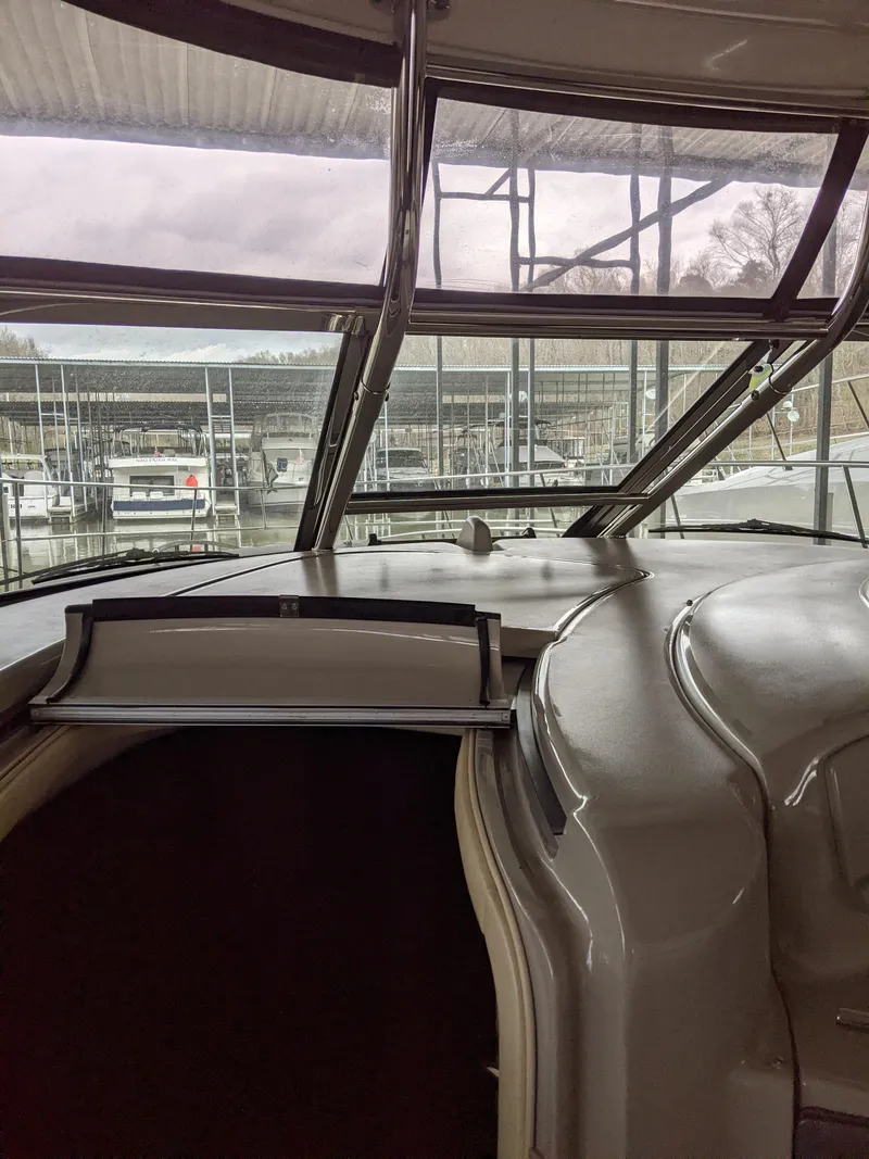 Slide: The Image of Interior view of 2006 Sea Ray 44 Sundancer yacht with marina background. - 17