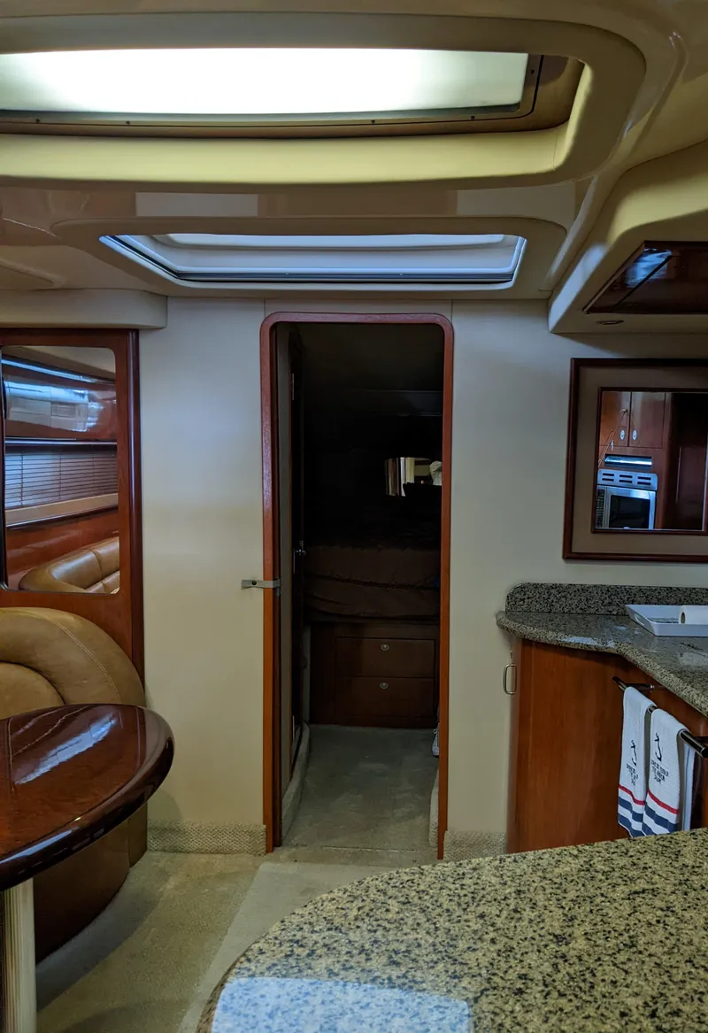 Slide: The Image of Interior of 2006 Sea Ray 44 Sundancer yacht with granite countertops and skylights. - 24