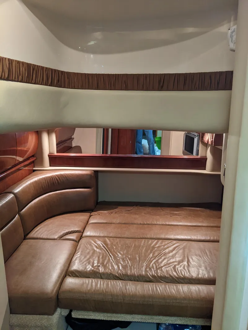 Slide: The Image of Interior cabin of a 2006 Sea Ray 44 Sundancer with leather seating. - 27