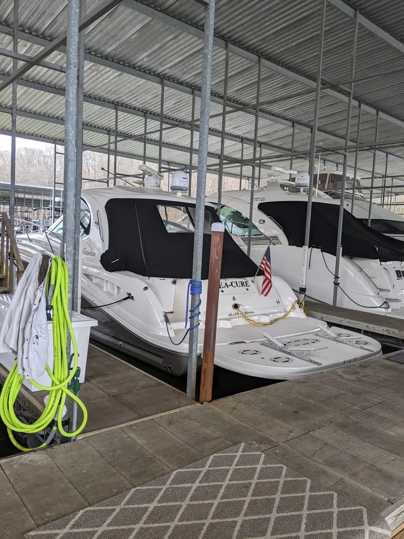 Slide: The Image of 2006 Sea Ray 44 Sundancer docked in a covered marina. - 4
