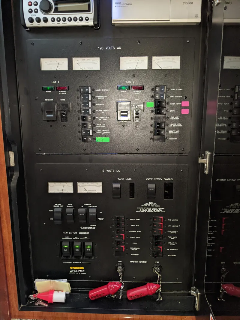 Slide: The Image of Electrical control panel on a 2006 Sea Ray 44 Sundancer yacht. - 42