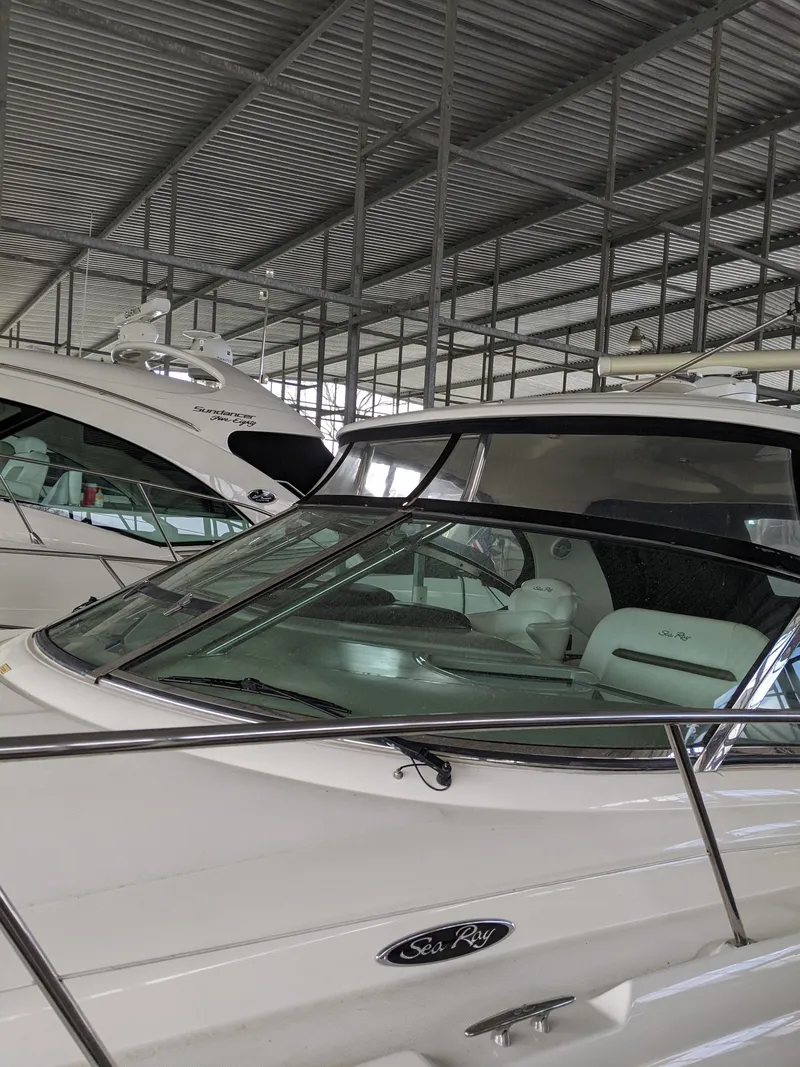 Slide: The Image of 2006 Sea Ray 44 Sundancer yacht docked in a covered marina. - 45