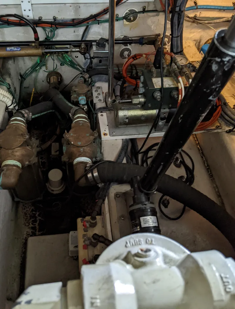 Slide: The Image of Engine compartment of a 2006 Sea Ray 44 Sundancer boat with various mechanical components. - 48