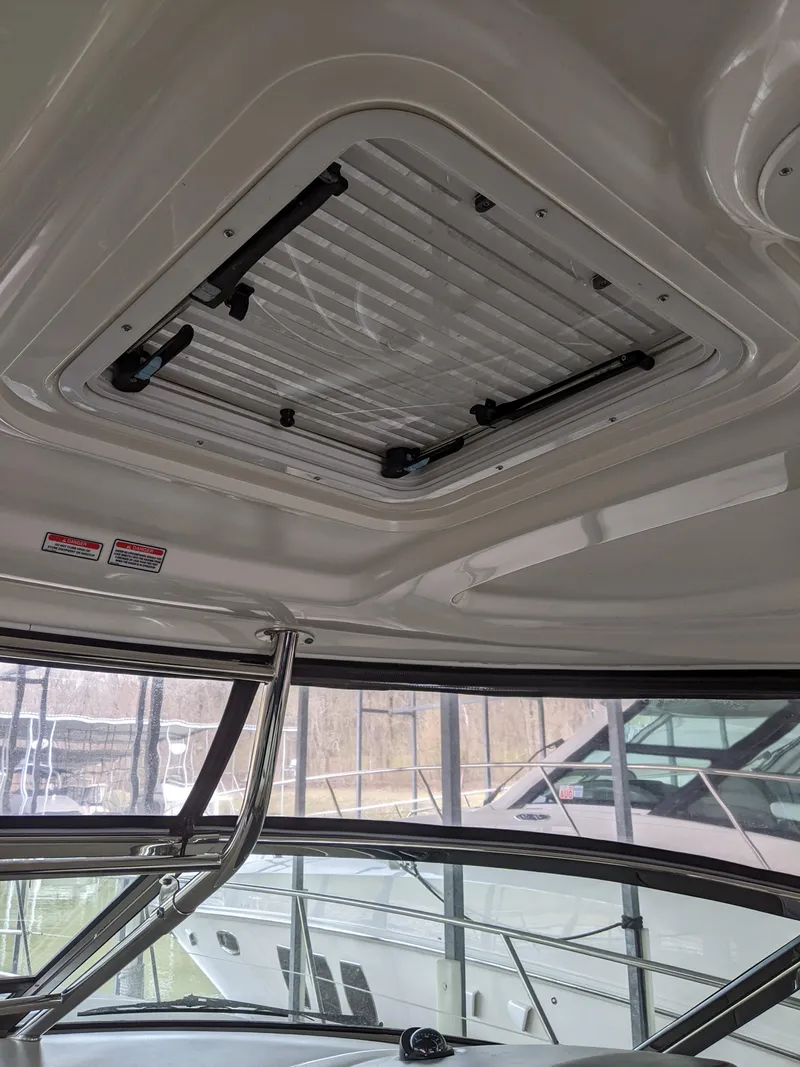 Slide: The Image of Interior view of 2006 Sea Ray 44 Sundancer yacht with sunroof and windows. - 9