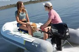 Slide: The Image of 2022 ZAR Mini Rib 10 Lite inflatable boat on water with two people. - 4