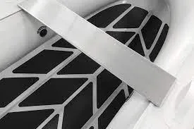 Slide: The Image of 2022 ZAR Mini Rib 10 Lite interior with black and white flooring. - 7