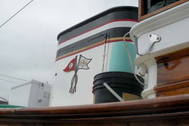 Slide: The Image of Alt text: 1929 Custom HOFFAR-BEECHING Fantail Yacht with detailed emblem on the side. - 11