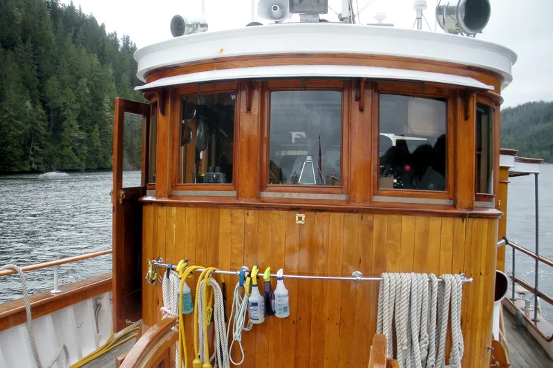 Slide: The Image of 1929 Custom HOFFAR-BEECHING Fantail Yacht with wooden cabin on a serene lake. - 12