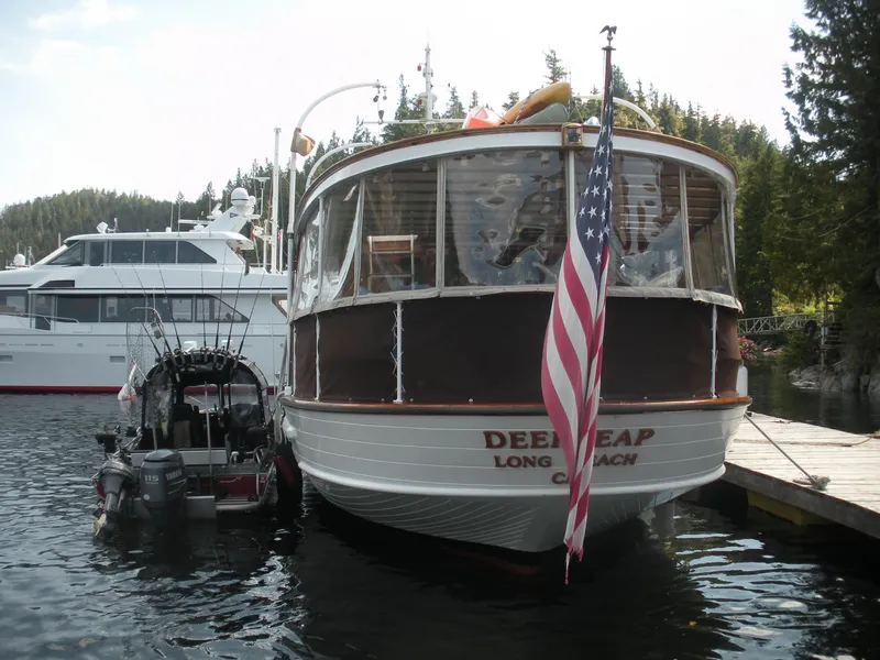 Slide: The Image of 1929 Custom HOFFAR-BEECHING Fantail Yacht docked with American flag. - 21