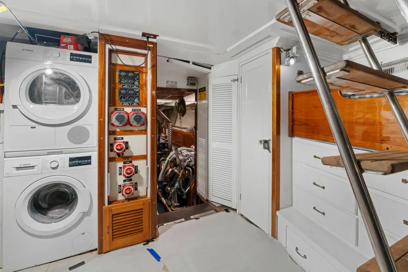 Slide: The Image of 1929 Custom HOFFAR-BEECHING Fantail Yacht interior with washer, dryer, and engine room access. - 30