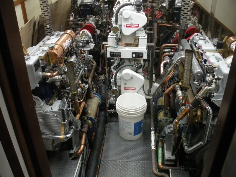 Slide: The Image of Engine room of a 1929 Custom HOFFAR-BEECHING Fantail Yacht with complex machinery. - 32