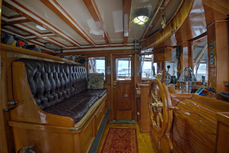 Slide: The Image of Interior of 1929 HOFFAR-BEECHING Fantail Yacht with wooden furnishings and leather seating. - 36