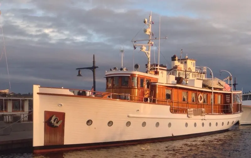 Slide: The Image of 1929 Custom HOFFAR-BEECHING Fantail Yacht docked at sunset. - 9