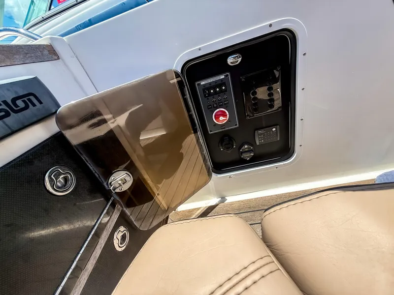 Slide: The Image of Control panel of a 2011 Novurania Chase 23 boat with seating and storage compartment. - 10